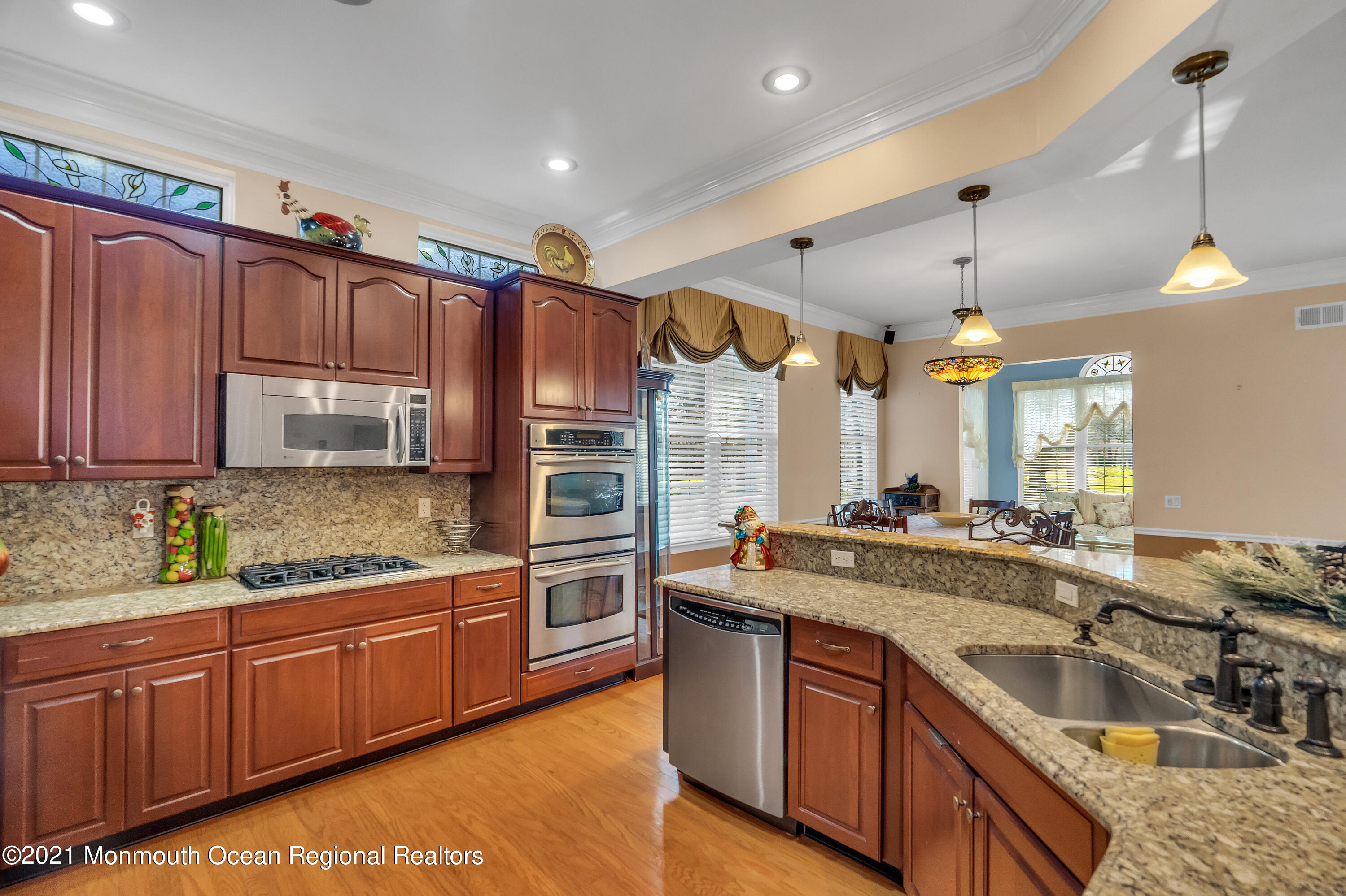 32 Crooked Stick Road Jackson, NJ 08527 - Photo 16 of 33 a kitchen with stainless steel appliances granite countertop a sink stove and cabinets