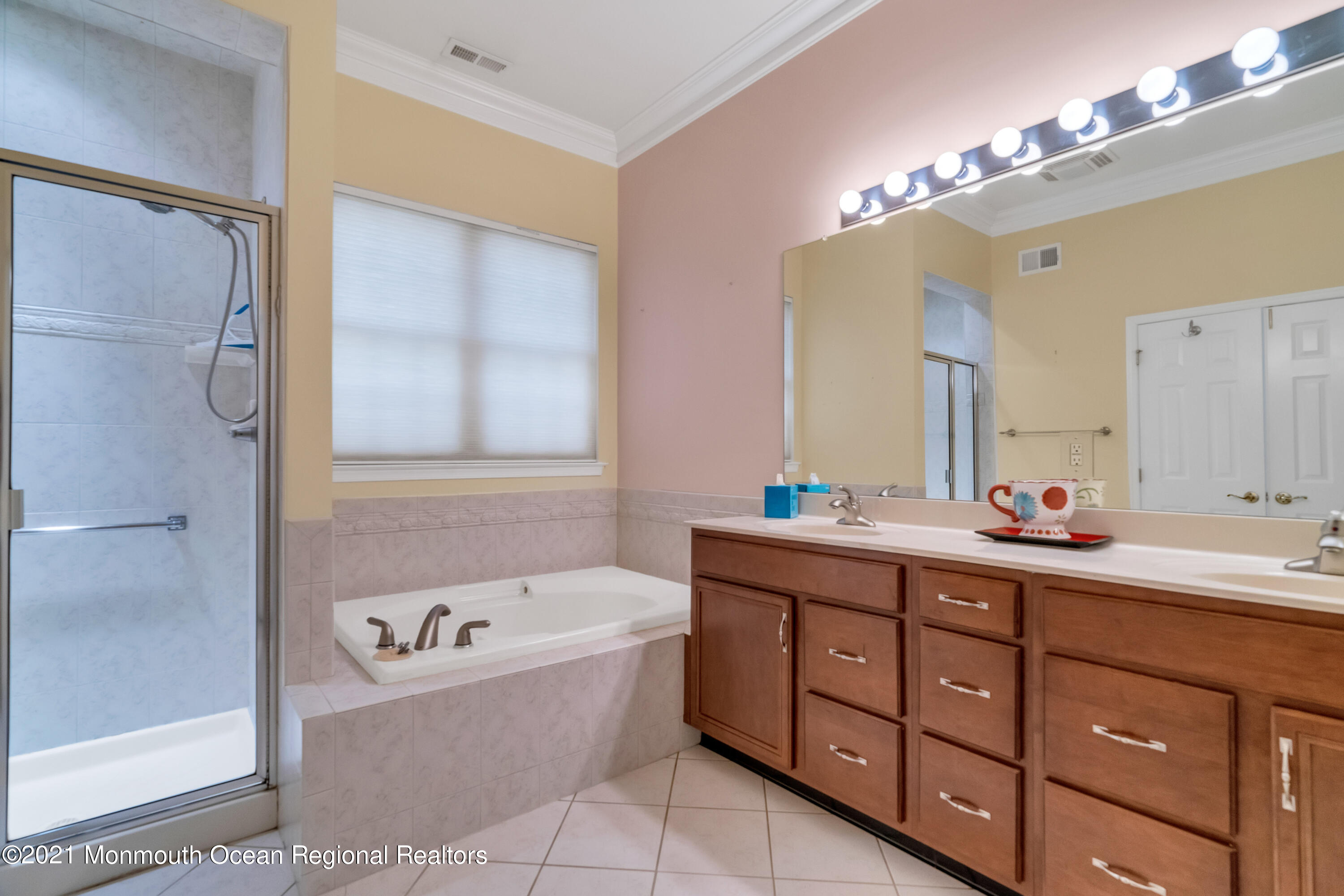 32 Crooked Stick Road Jackson, NJ 08527 - Photo 21 of 33 a spacious bathroom with a tub sink and mirror