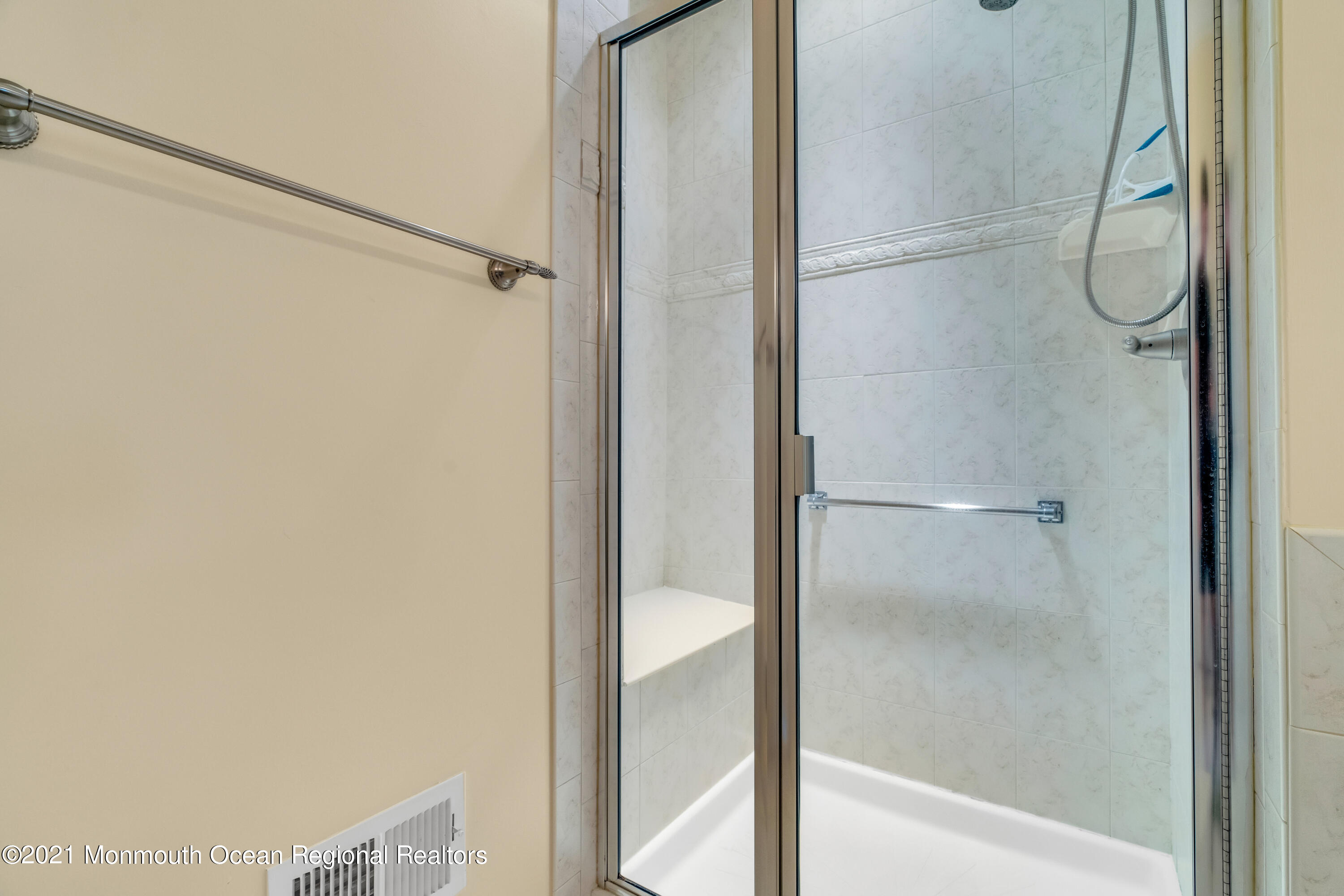 32 Crooked Stick Road Jackson, NJ 08527 - Photo 23 of 33 a bathroom with a glass shower door