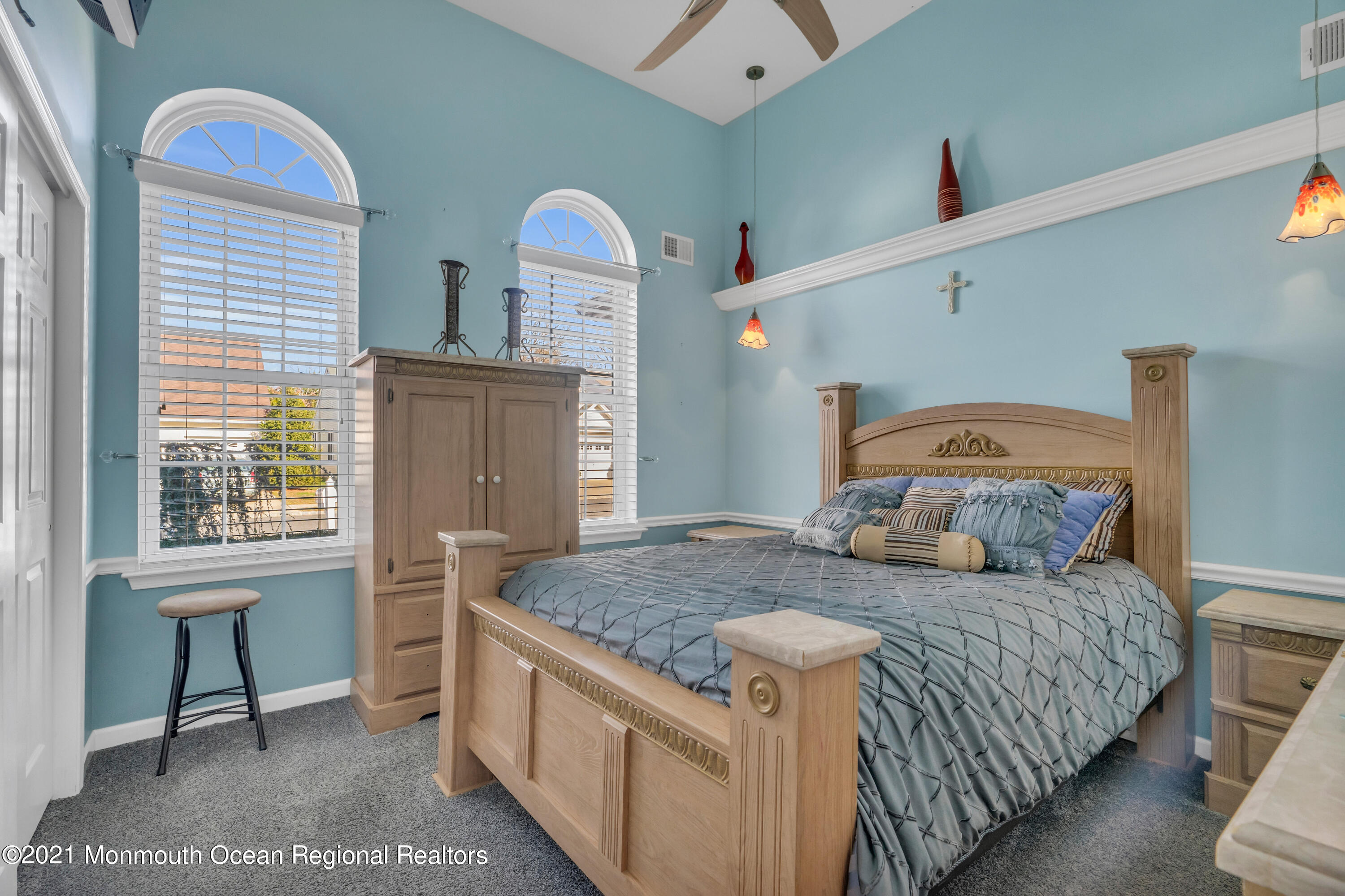 32 Crooked Stick Road Jackson, NJ 08527 - Photo 25 of 33 a bedroom with a bed and a table in it