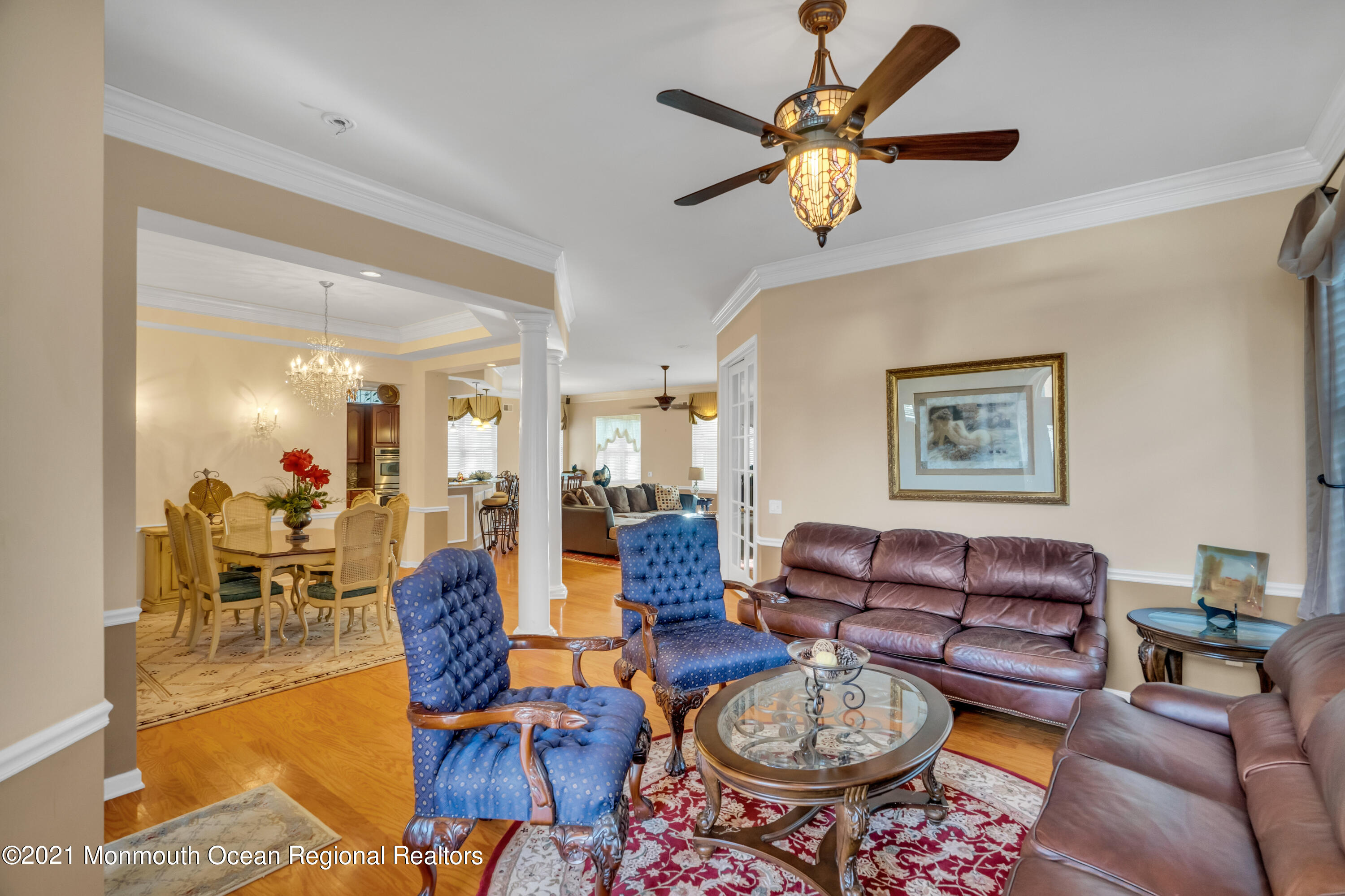 32 Crooked Stick Road Jackson, NJ 08527 - Photo 8 of 33 a living room with furniture a rug and a chandelier