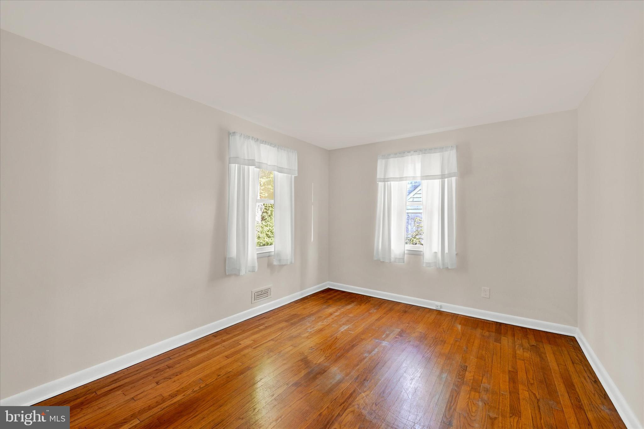 6754 Glenkirk Road Baltimore, MD 21239 - Photo 13 of 24 Bedroom 2 with Hardwood Flooring