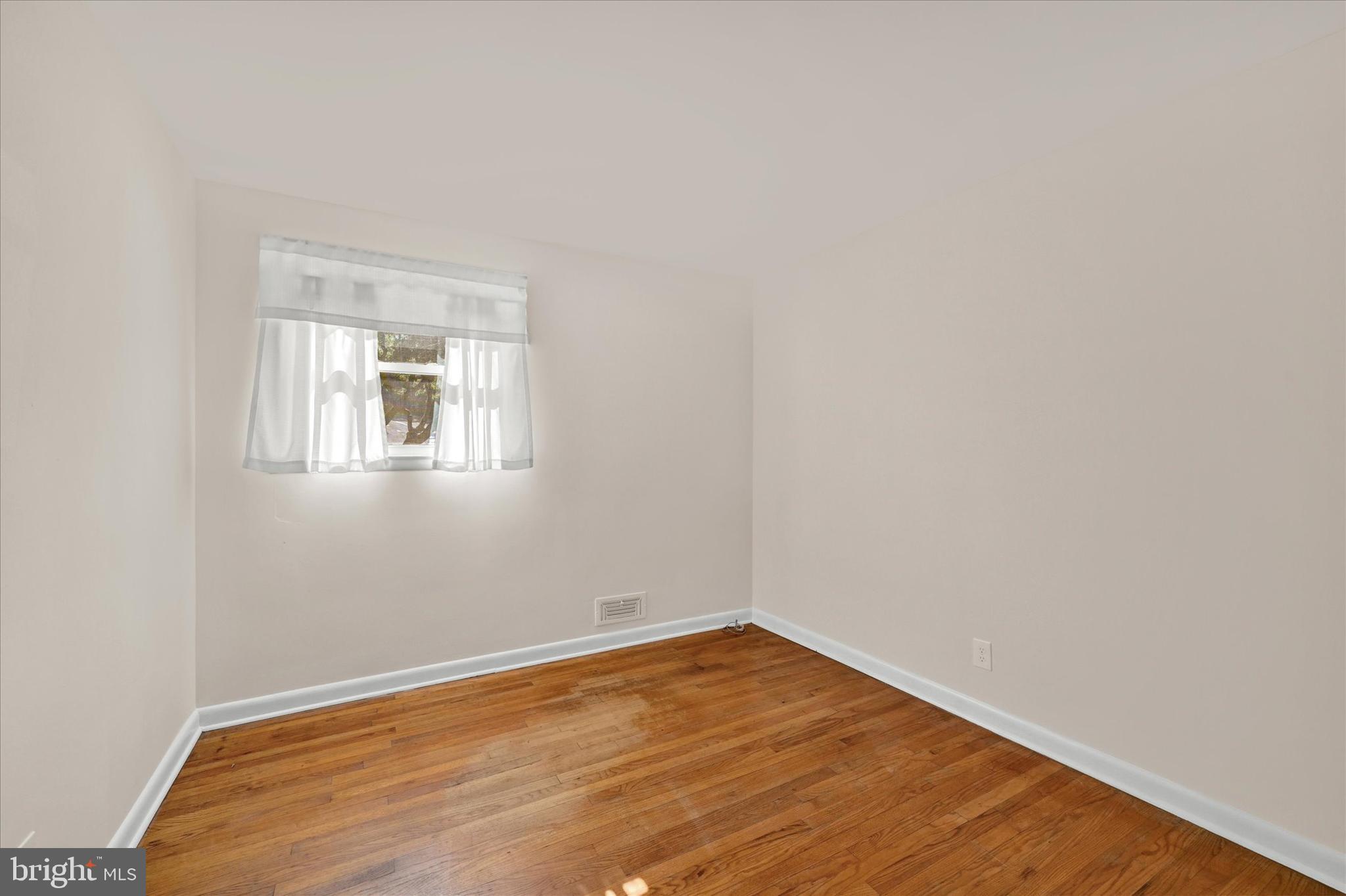 6754 Glenkirk Road Baltimore, MD 21239 - Photo 15 of 24 Bedroom 3 w/Fresh Paint & Hardwood Flooring