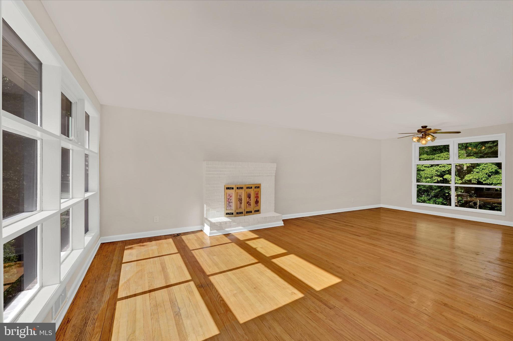 6754 Glenkirk Road Baltimore, MD 21239 - Photo 2 of 24 Living Room with Fresh Paint & Hardwood Flooring