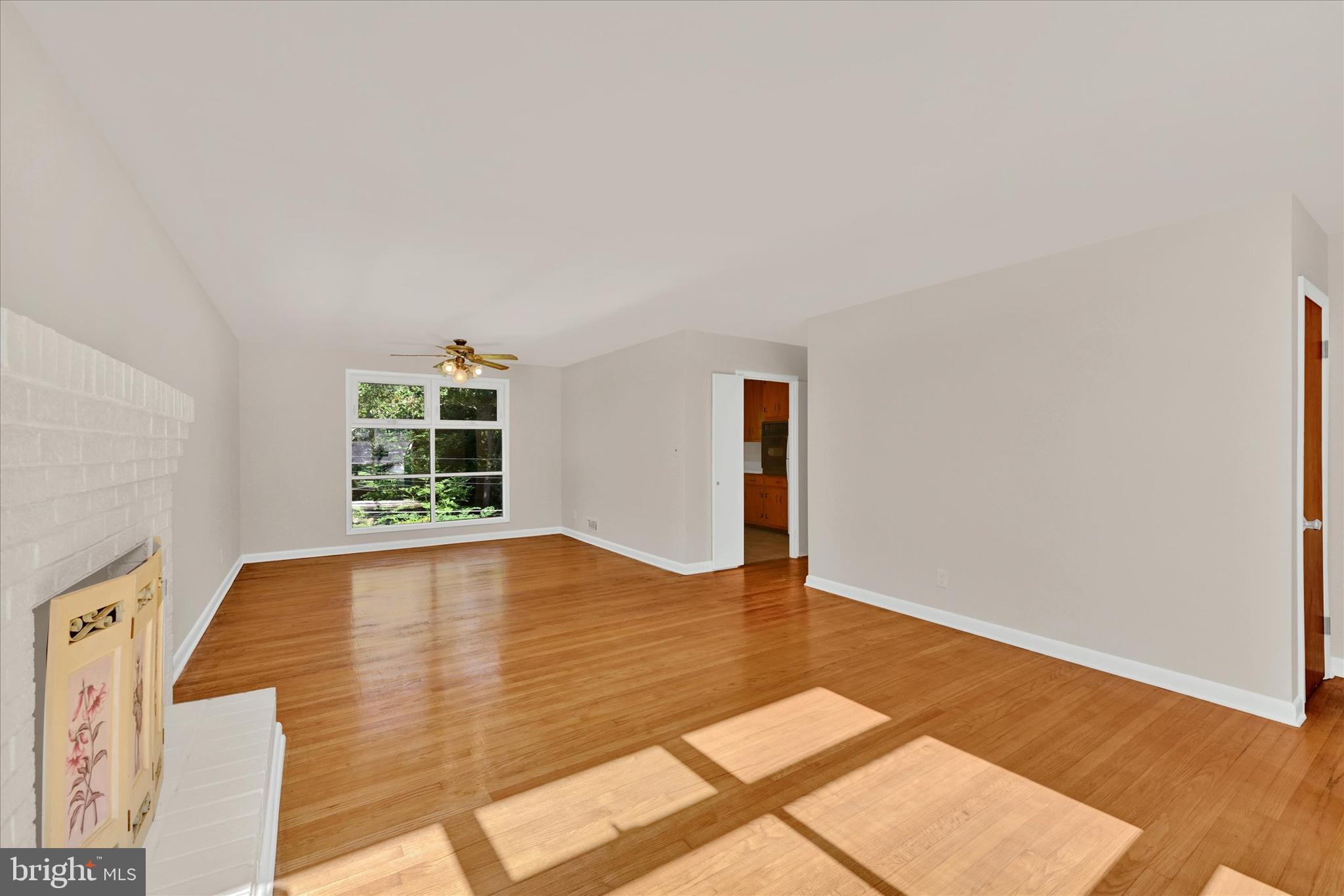6754 Glenkirk Road Baltimore, MD 21239 - Photo 4 of 24 Living Room to Dining Room