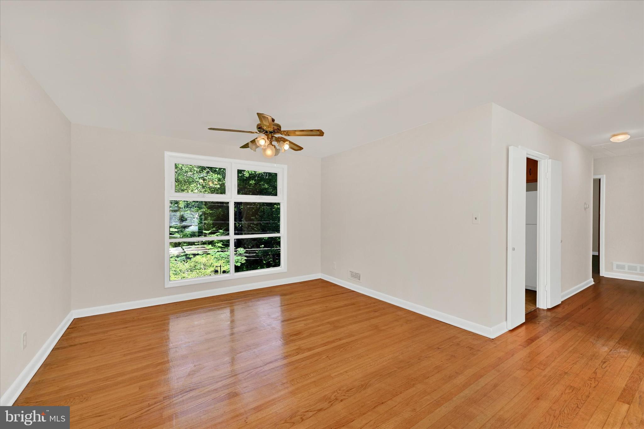 6754 Glenkirk Road Baltimore, MD 21239 - Photo 5 of 24 Dining Room with Hardwood Flooring & Ceiling Fan