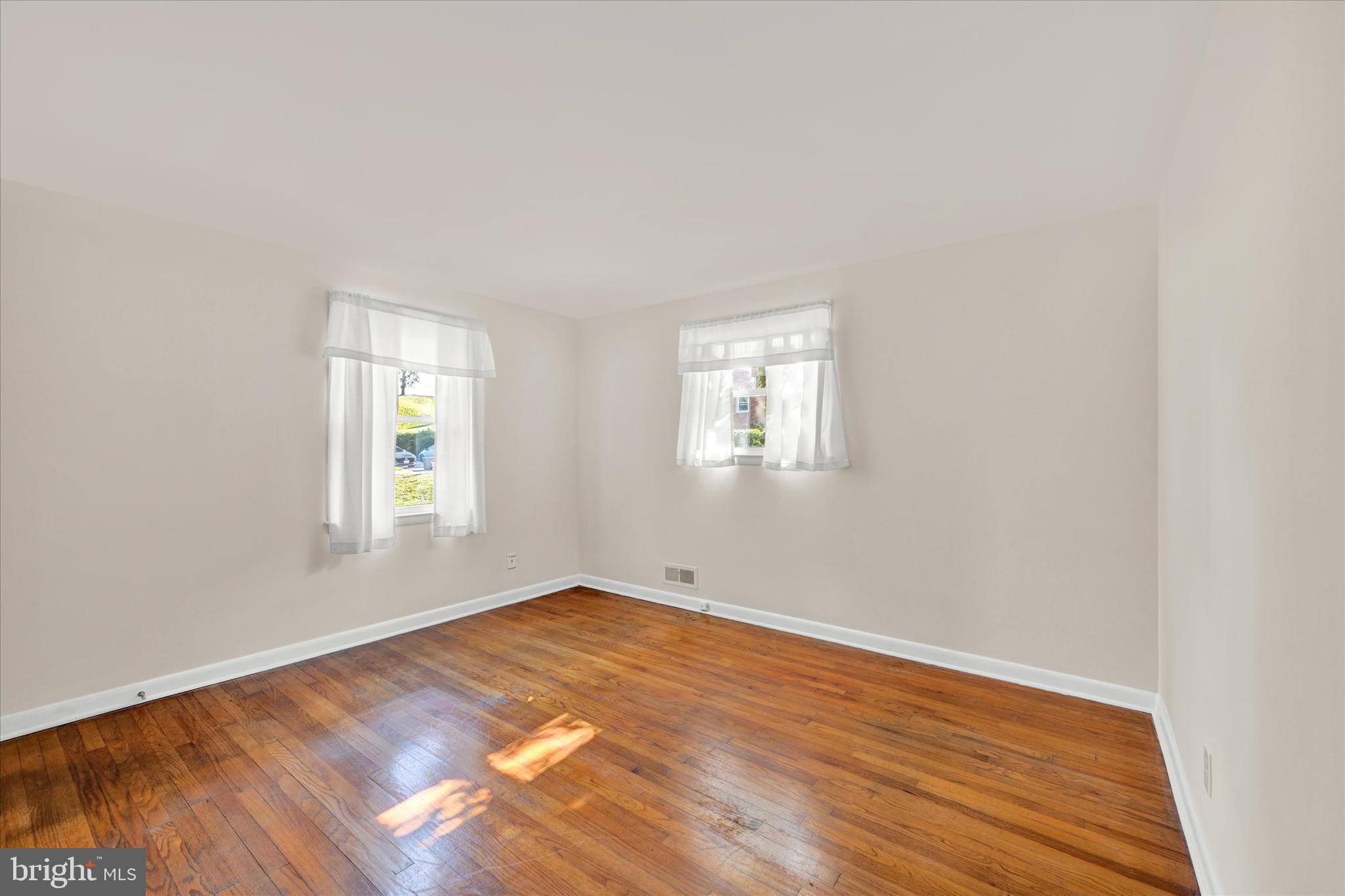 6754 Glenkirk Road Baltimore, MD 21239 - Photo 10 of 24 Primary Bedroom with Hardwood Flooring
