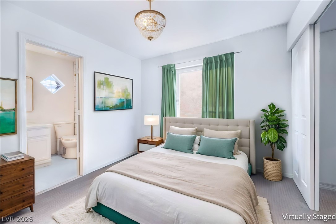 1941 Ivy Point Lane Las Vegas, NV 89134 - Photo 12 of 21 This serene sleeping area features light-toned flooring, a plush bed, and convenient en-suite bathroom access.