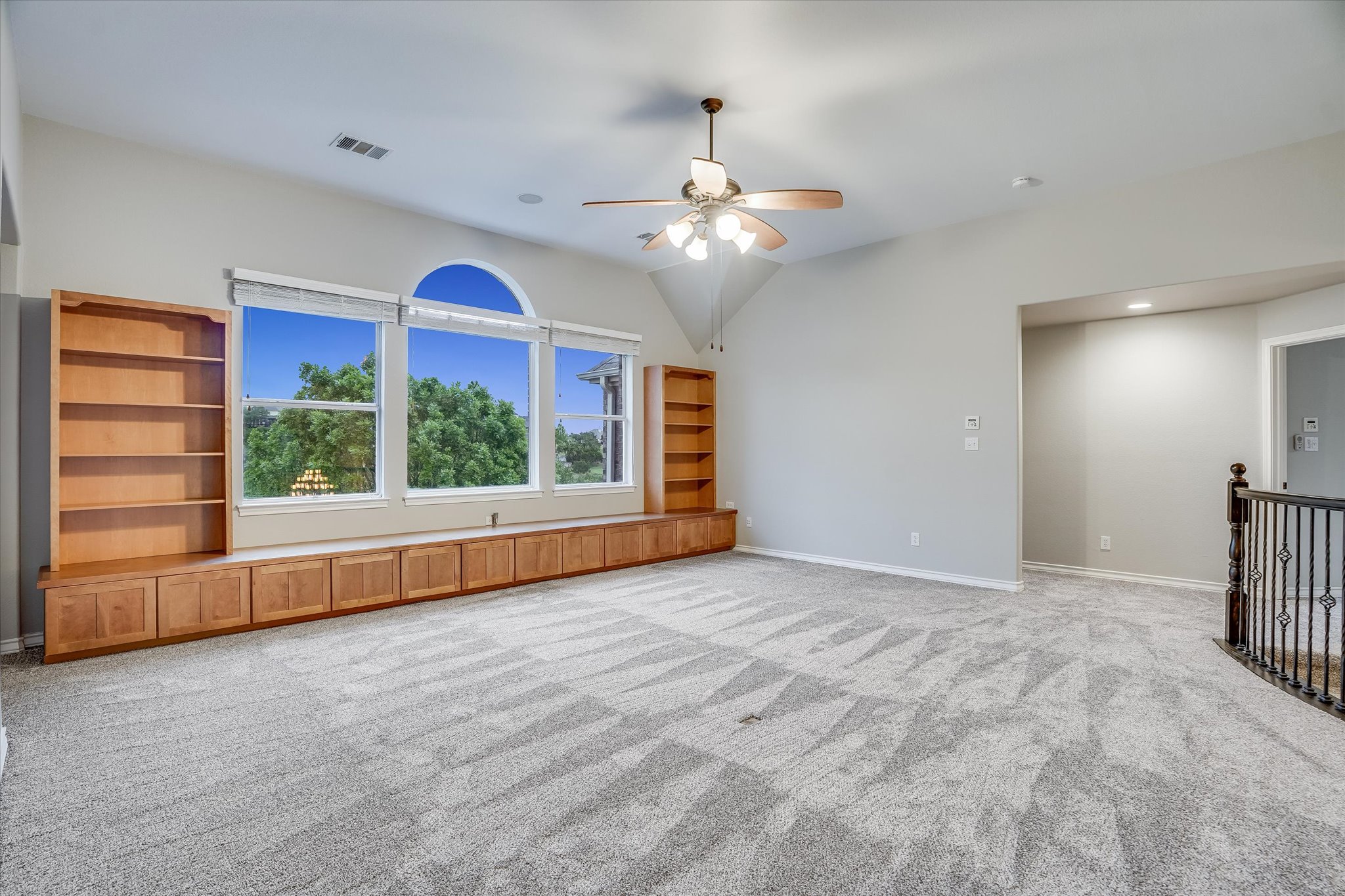 1400 Tom Sawyer Road Austin, TX 78737 - Photo 22 of 40 Open loft-style game room with vaulted ceilings and natural light.