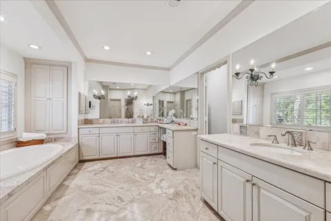 a large kitchen with a sink and cabinets