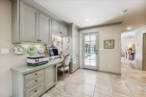a kitchen with stainless steel appliances granite countertop a refrigerator and a stove