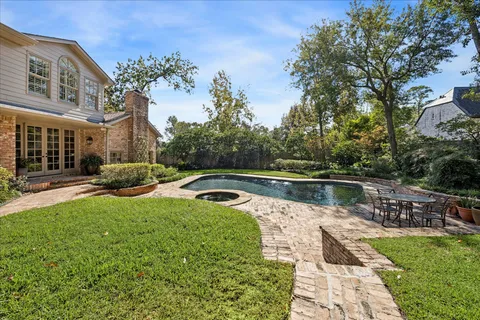 a view of swimming pool with a patio