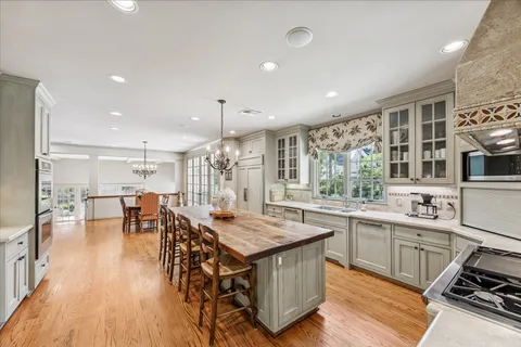 a kitchen with lots of counter top space and stainless steel appliances