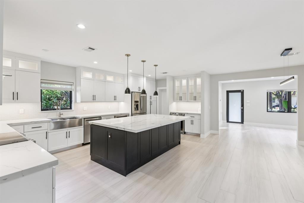 1660 Southwest 32nd Court Miami, FL 33145 - Photo 11 of 34 a large kitchen with a lot of counter space and a sink