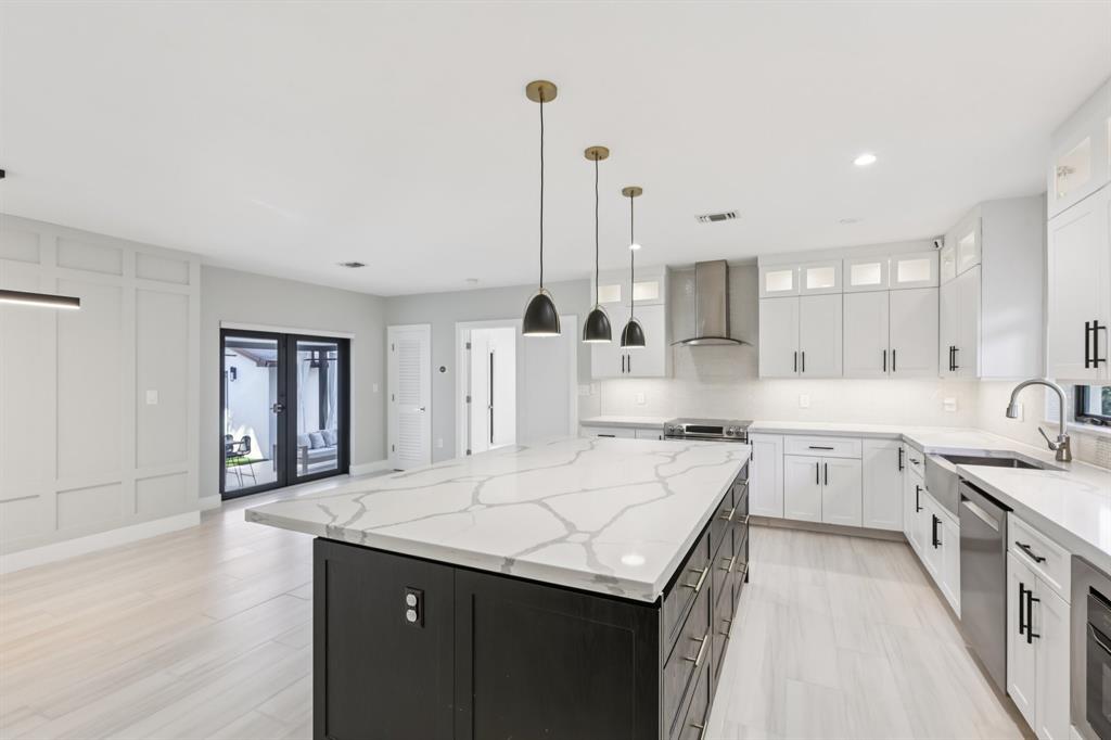 1660 Southwest 32nd Court Miami, FL 33145 - Photo 13 of 34 a kitchen with a sink a stove and cabinets