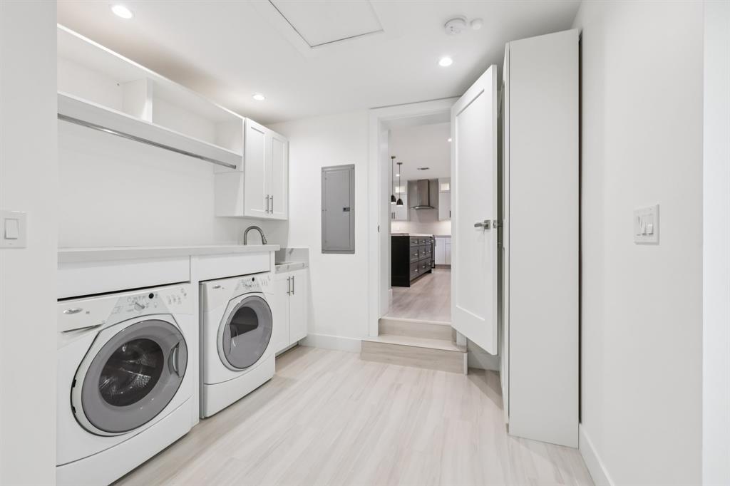 1660 Southwest 32nd Court Miami, FL 33145 - Photo 15 of 34 a view of washer and dryer with kitchen in the background