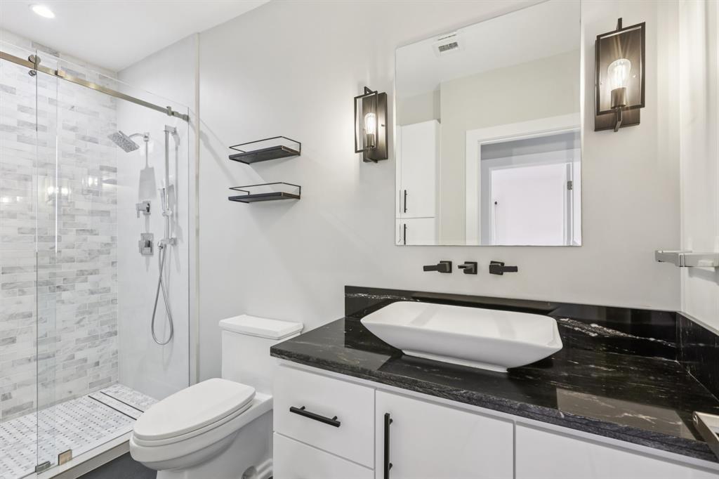 1660 Southwest 32nd Court Miami, FL 33145 - Photo 22 of 34 a bathroom with a granite countertop sink toilet and shower