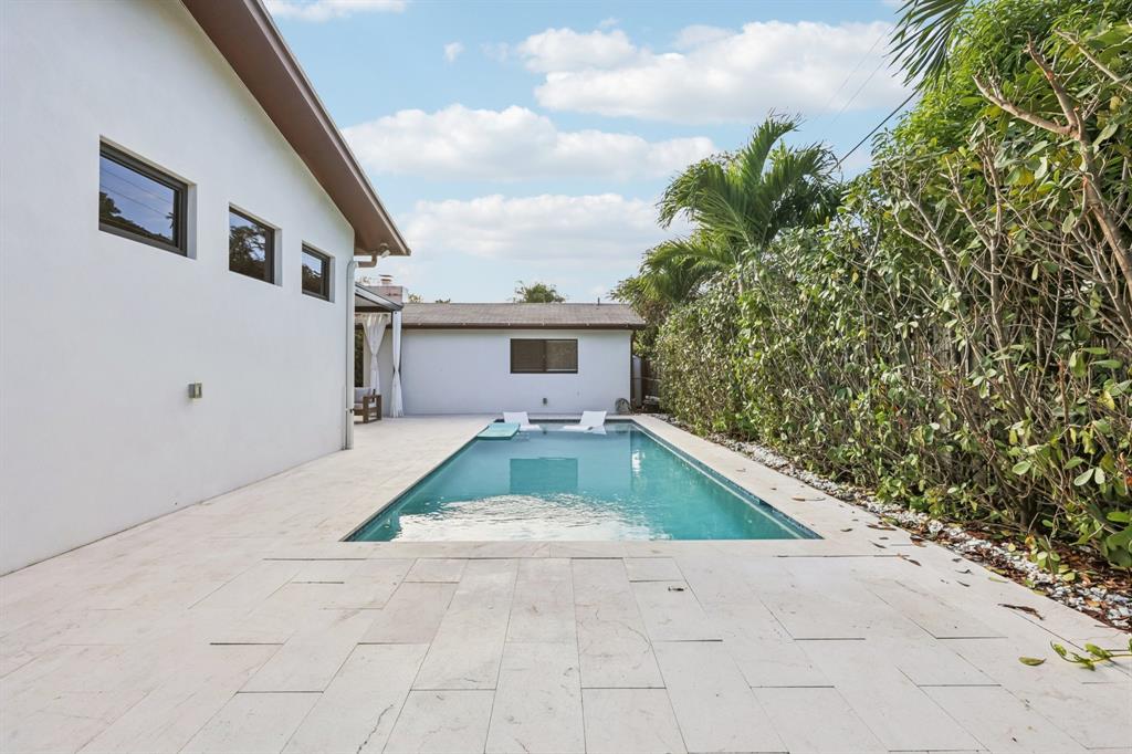 1660 Southwest 32nd Court Miami, FL 33145 - Photo 24 of 34 a house view with a backyard space