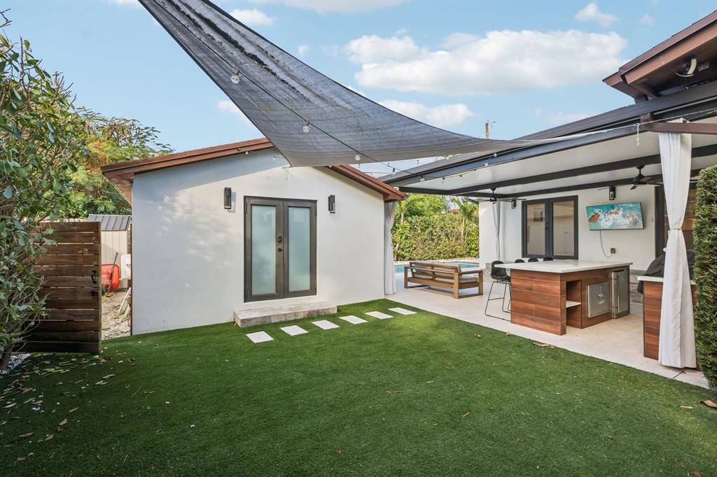 1660 Southwest 32nd Court Miami, FL 33145 - Photo 27 of 34 a view of an house with backyard porch and furniture