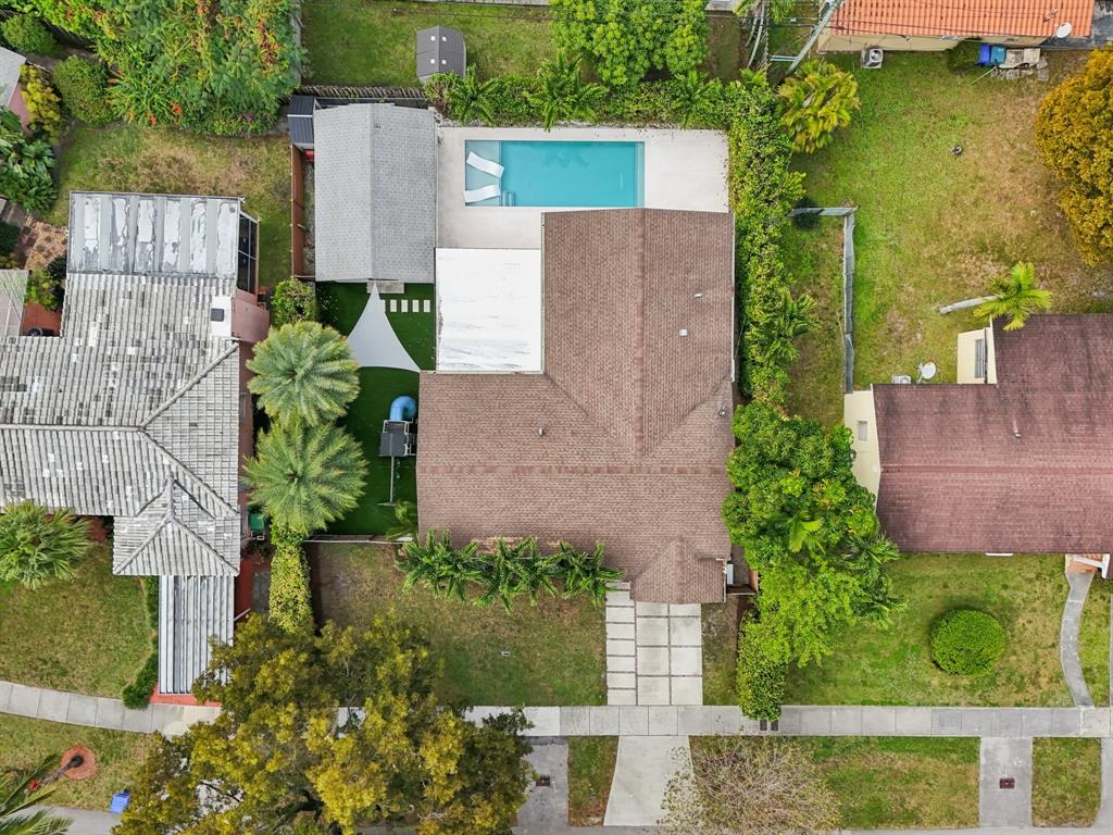 1660 Southwest 32nd Court Miami, FL 33145 - Photo 34 of 34 an aerial view of a house with a yard and a garden