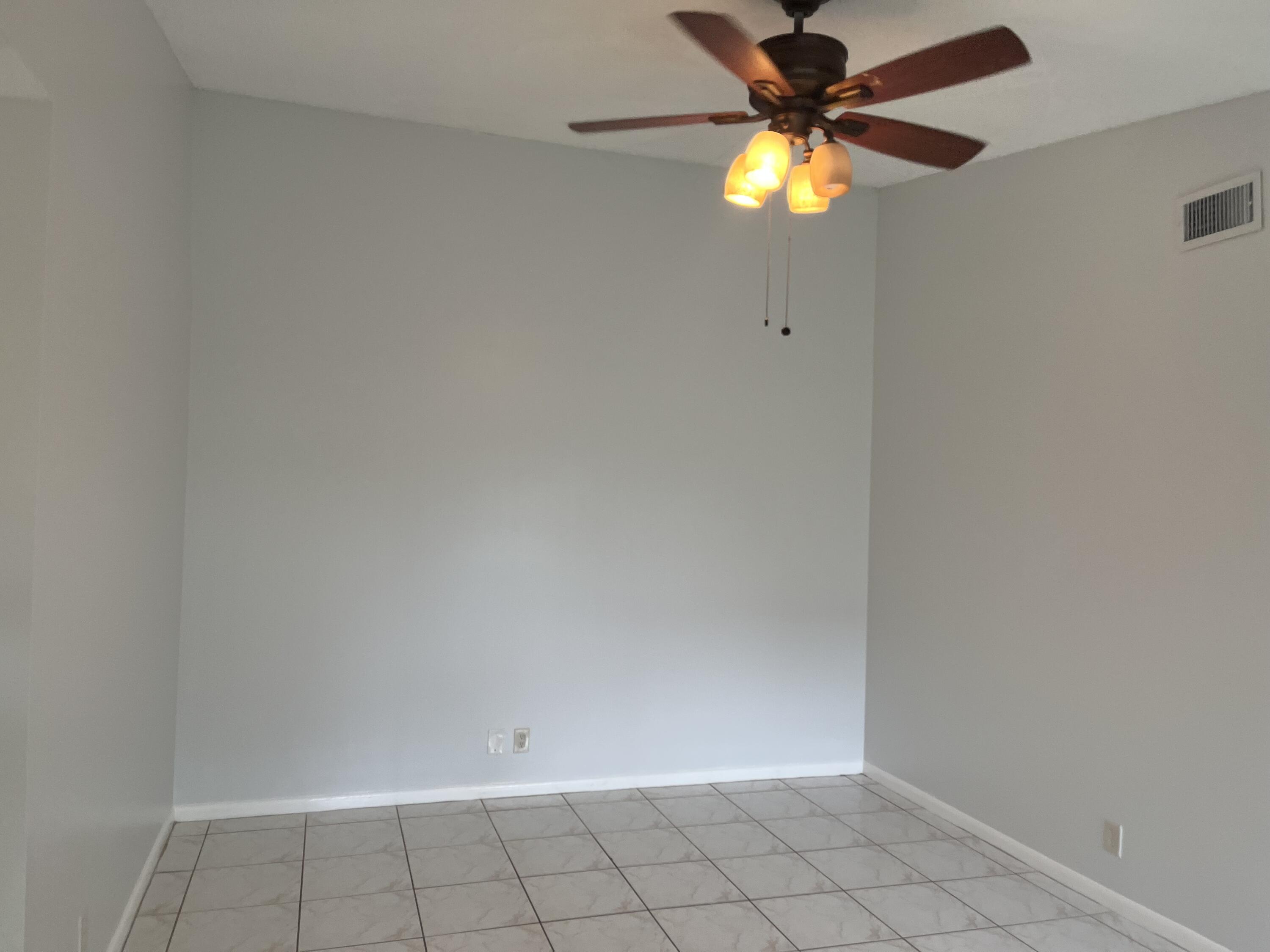2103 Waterview Circle Palm Springs, FL 33461 - Photo 6 of 16 a view of an empty room with a window