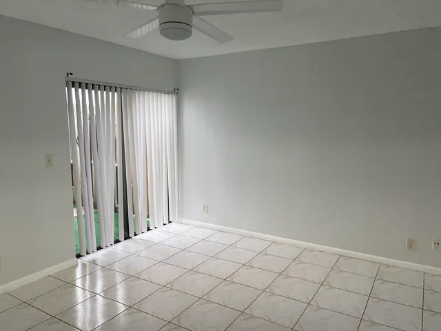 an empty room with fan