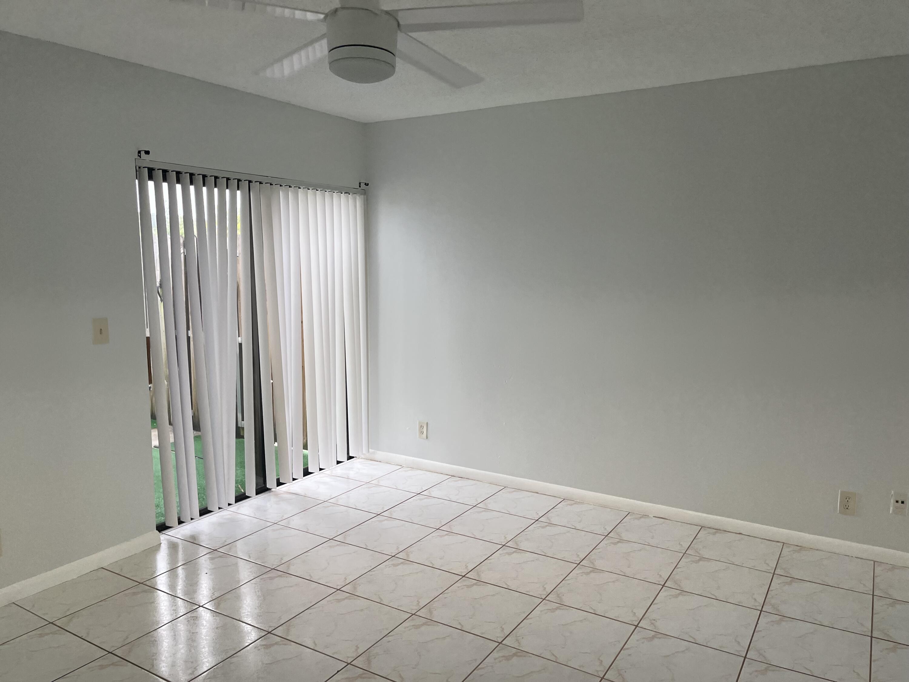 2103 Waterview Circle Palm Springs, FL 33461 - Photo 7 of 16 an empty room with fan