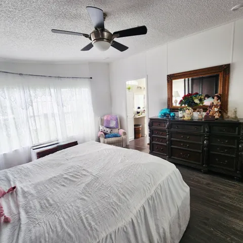 a bedroom with furniture and a window
