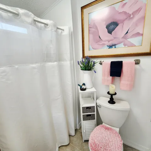 a view of a house with palm trees