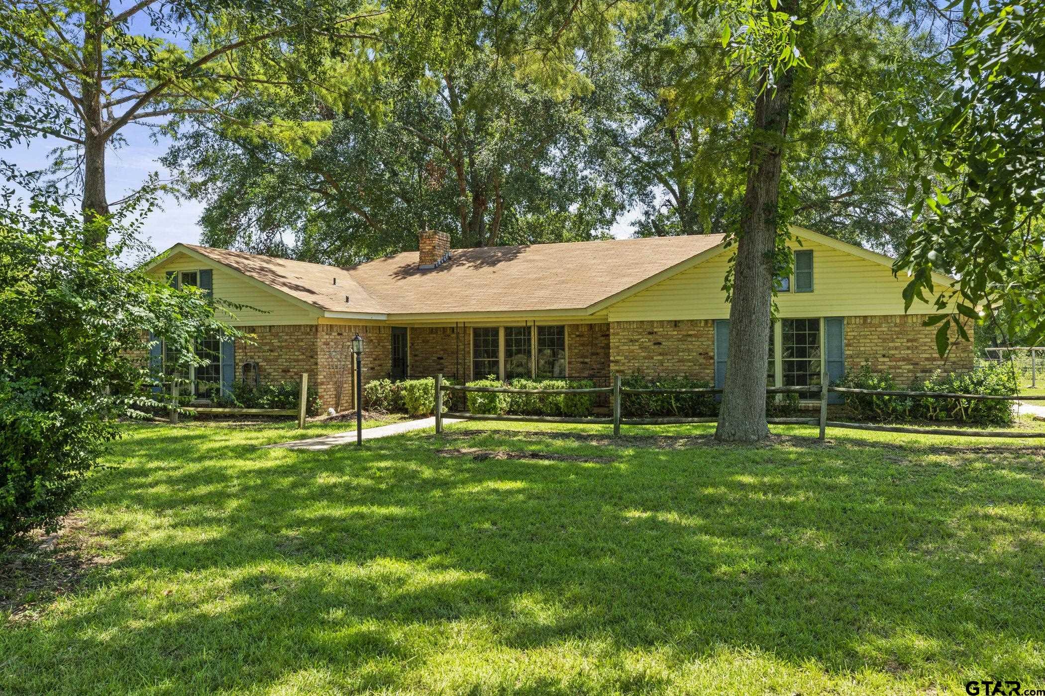 22741 County Road 448 Lindale, TX 75771 - Photo 1 of 48 a front view of a house with a yard