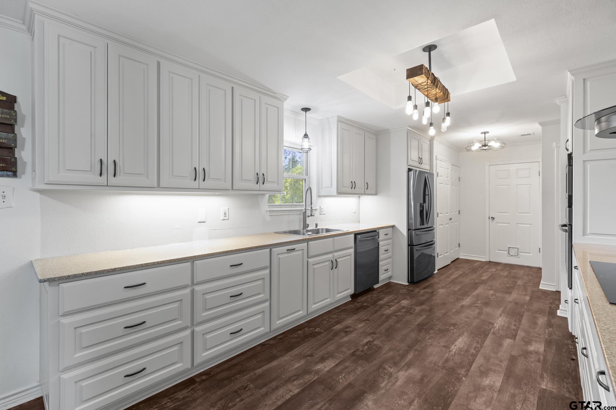 22741 County Road 448 Lindale, TX 75771 - Photo 14 of 48 a kitchen with a refrigerator a sink and cabinets