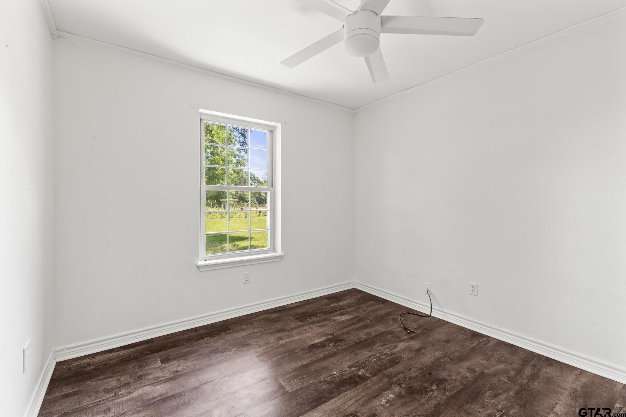 22741 County Road 448 Lindale, TX 75771 - Photo 17 of 48 wooden floor in an empty room with a window