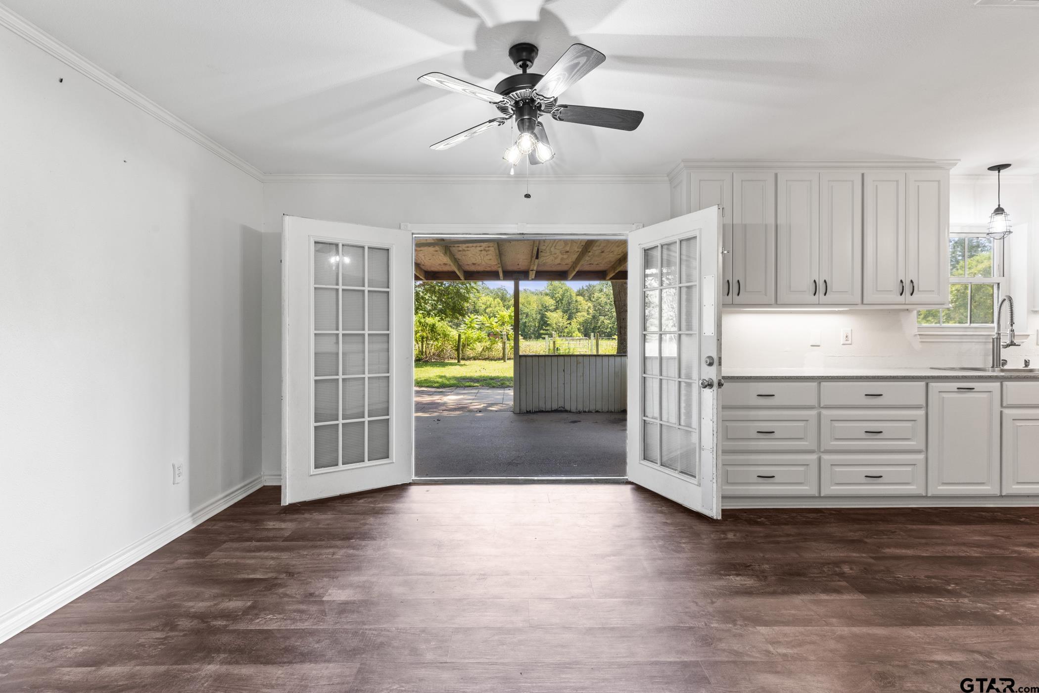22741 County Road 448 Lindale, TX 75771 - Photo 20 of 48 an empty room with chandelier fan and windows