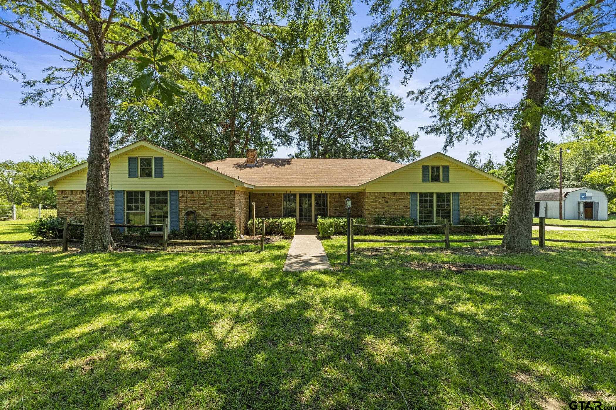 22741 County Road 448 Lindale, TX 75771 - Photo 2 of 48 a front view of a house with yard and green space