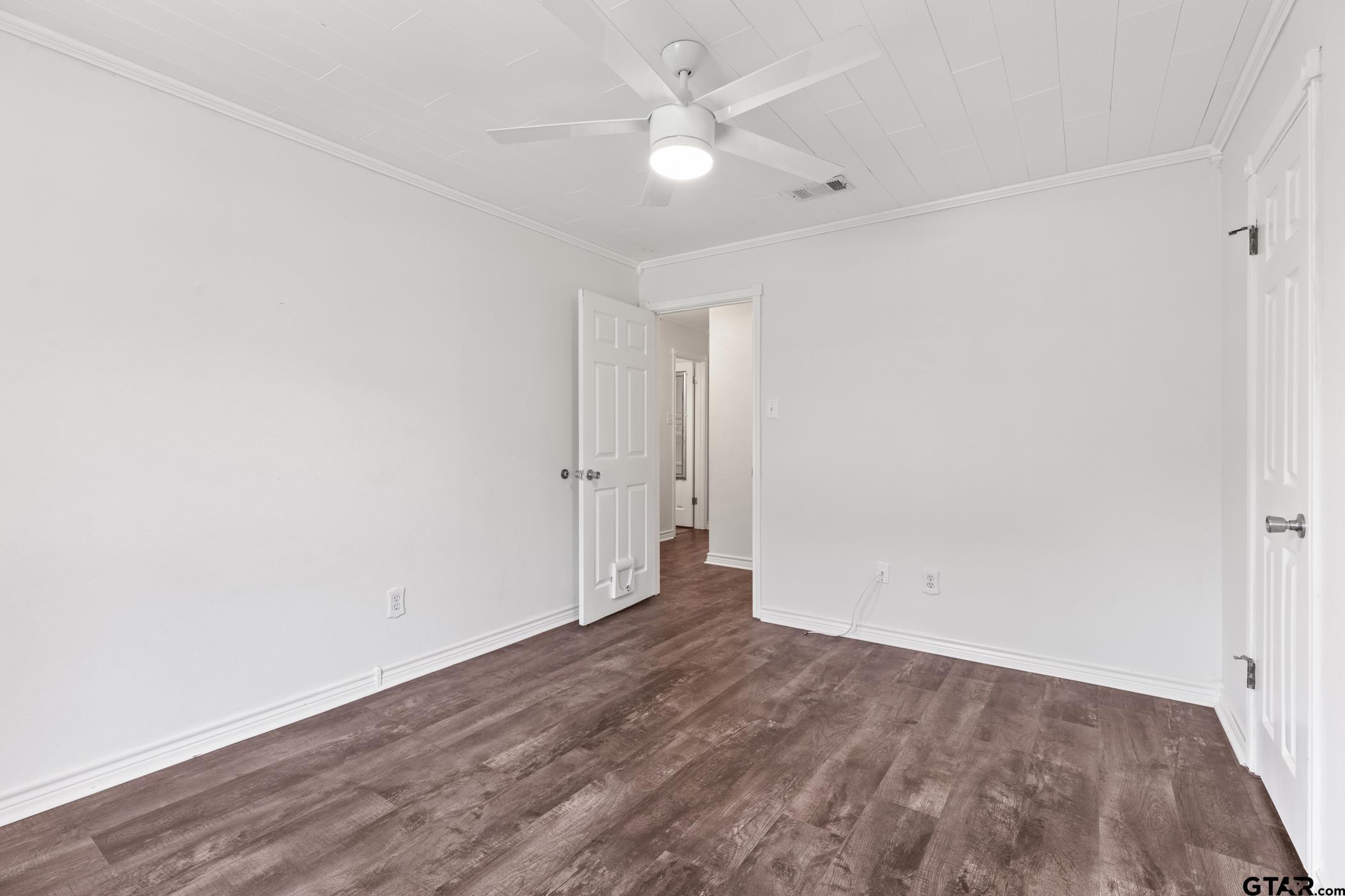 22741 County Road 448 Lindale, TX 75771 - Photo 26 of 48 an empty room with wooden floor and fan