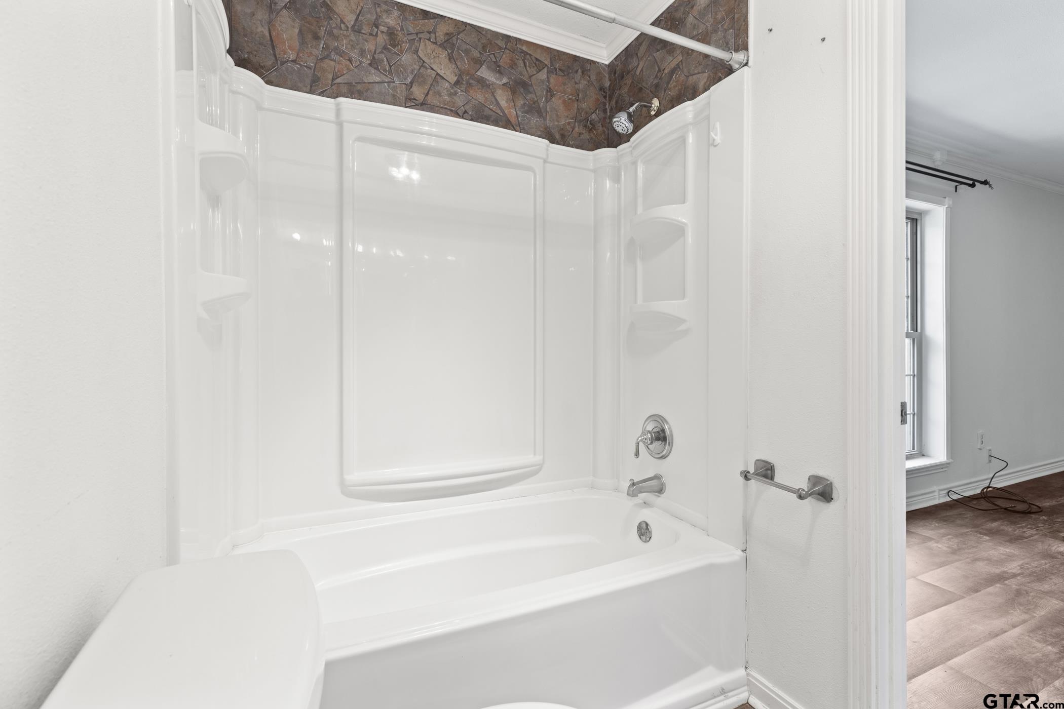 22741 County Road 448 Lindale, TX 75771 - Photo 32 of 48 a bathroom with a bathtub and a shower