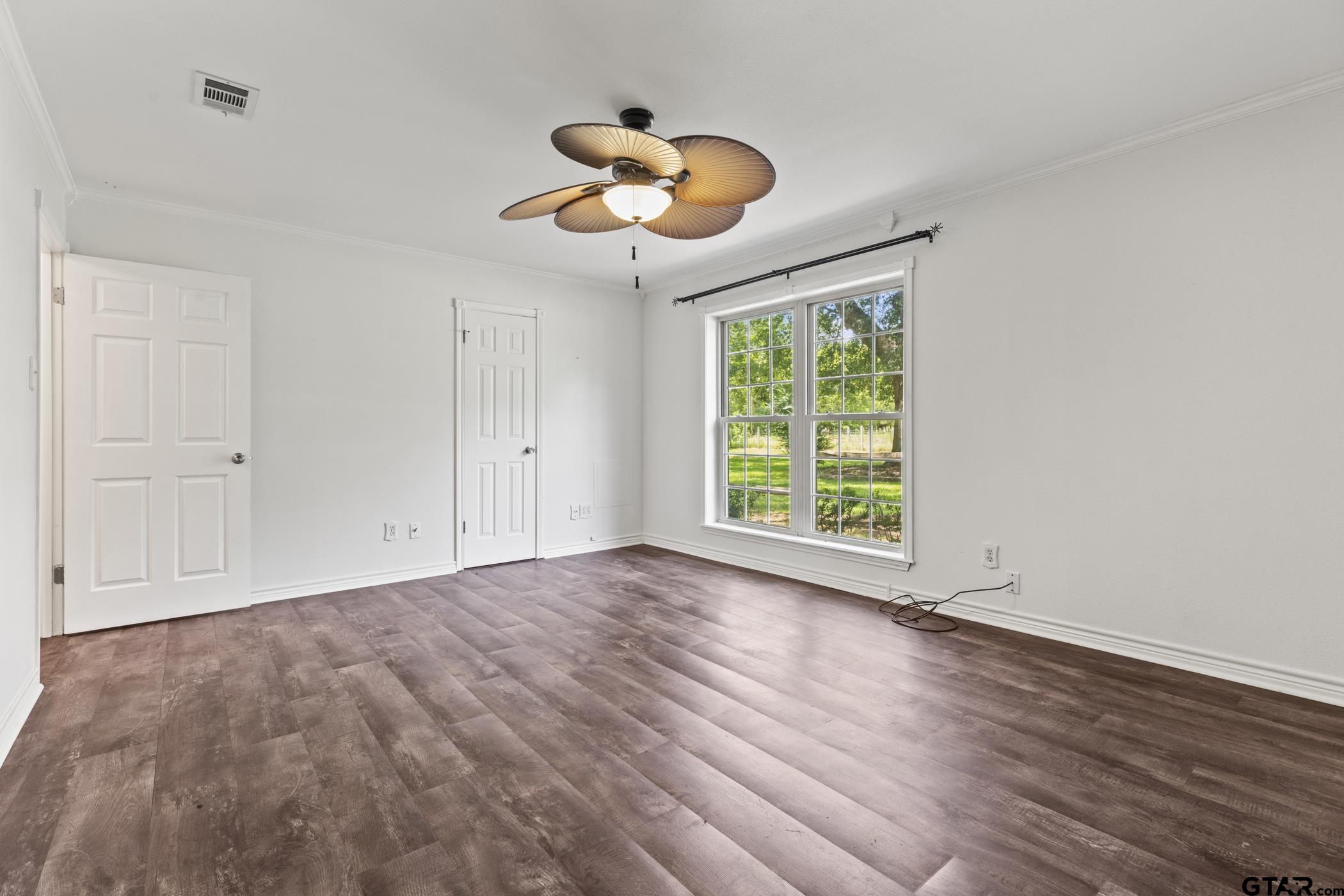 22741 County Road 448 Lindale, TX 75771 - Photo 33 of 48 an empty room with wooden floor and windows