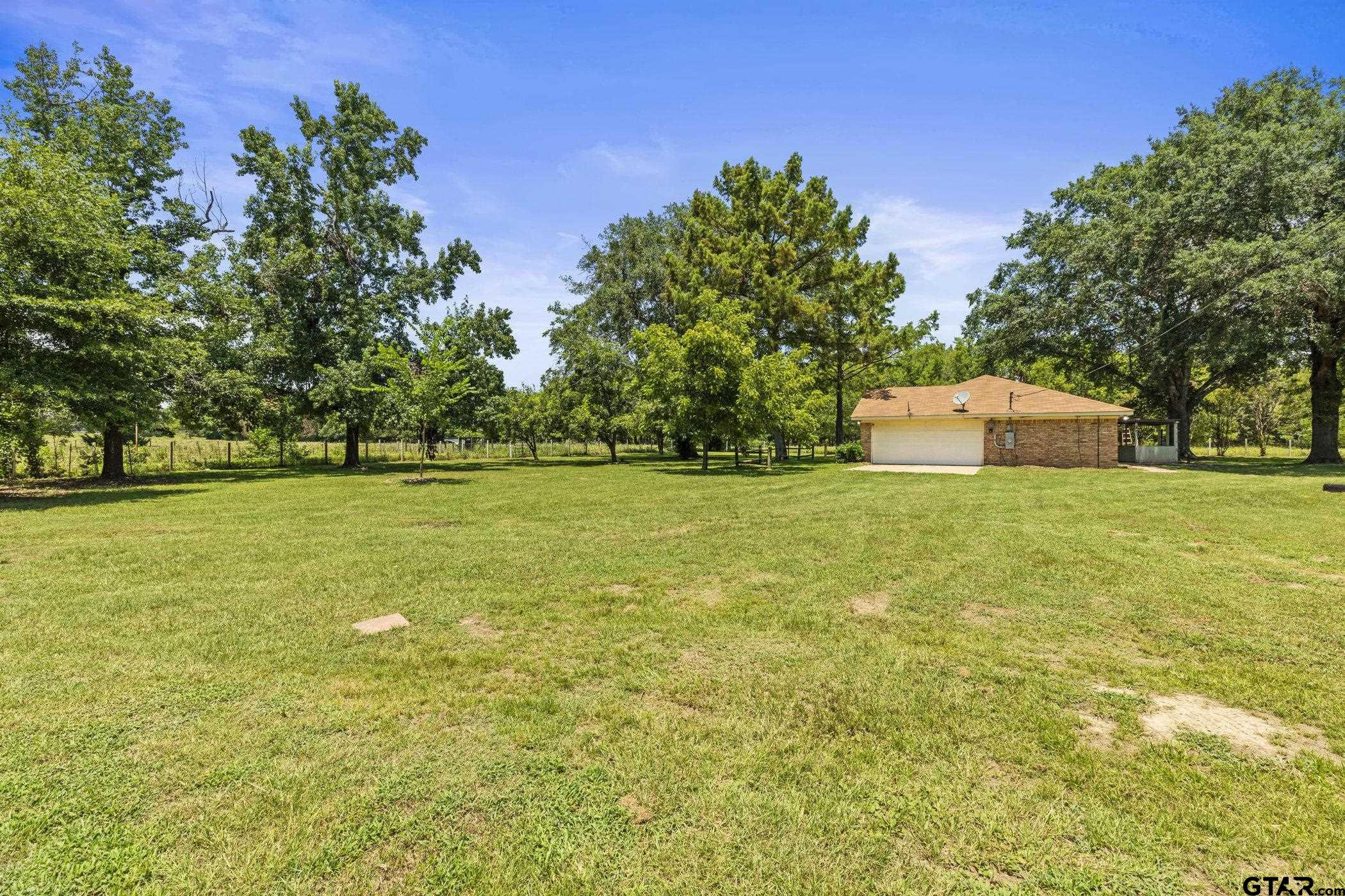 22741 County Road 448 Lindale, TX 75771 - Photo 40 of 48 a view of a field with trees in the background