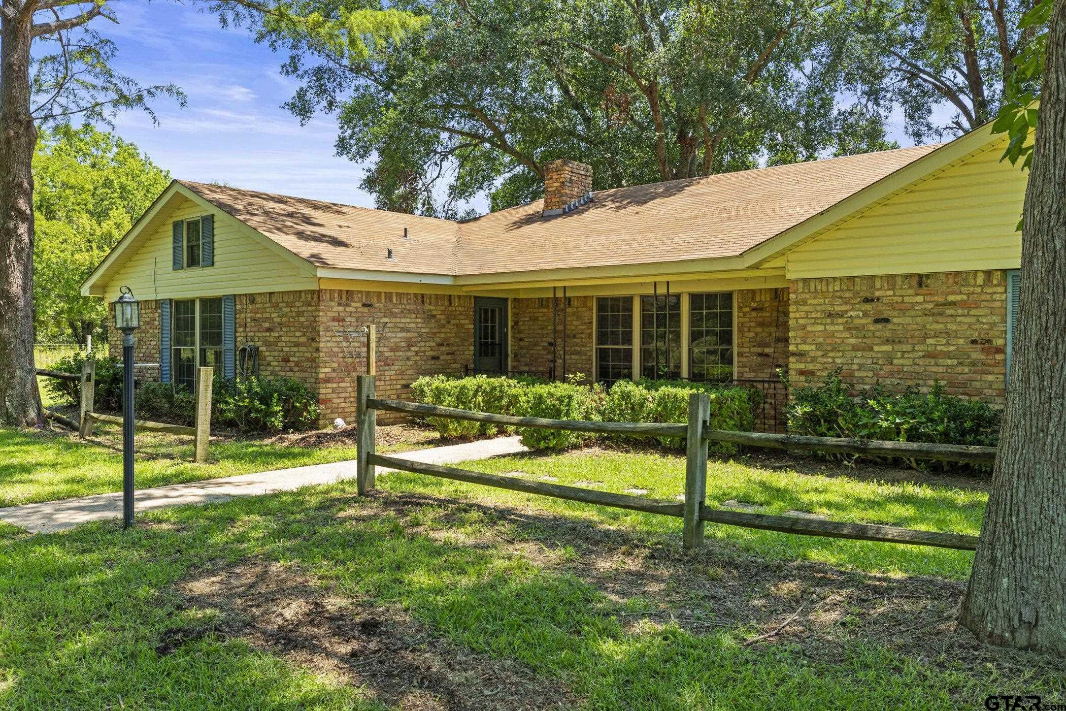 22741 County Road 448 Lindale, TX 75771 - Photo 4 of 48 a view of a house with backyard and a backyard