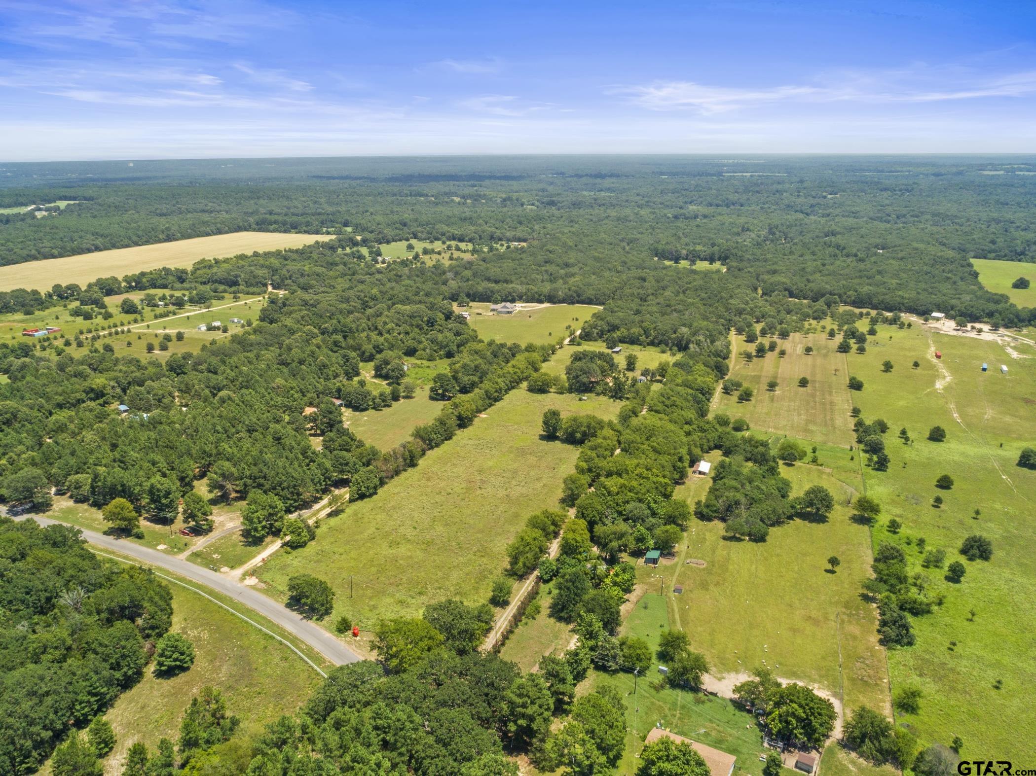 22741 County Road 448 Lindale, TX 75771 - Photo 45 of 48 a view of a lake with a yard