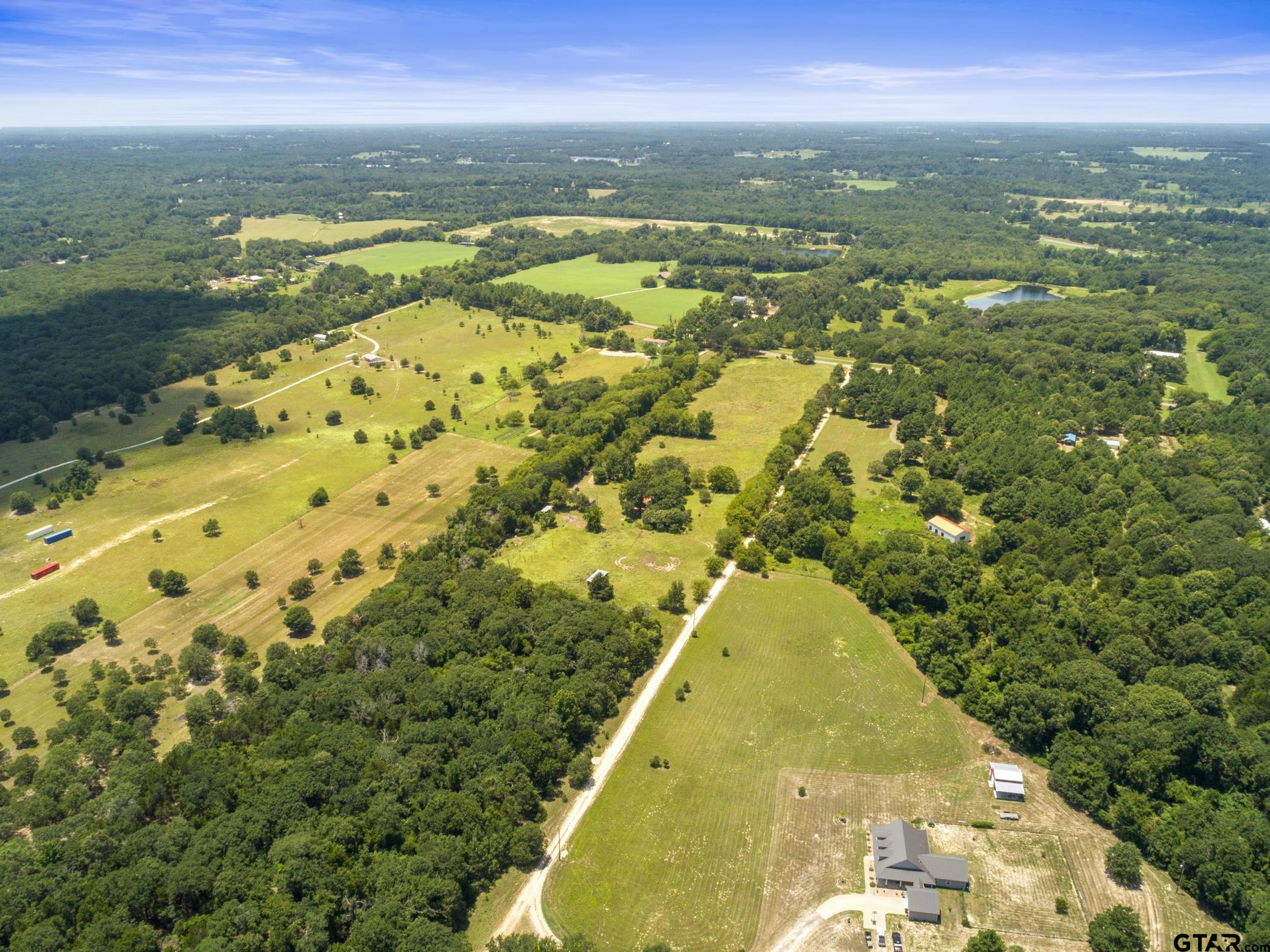 22741 County Road 448 Lindale, TX 75771 - Photo 47 of 48 a view of a lake with a city