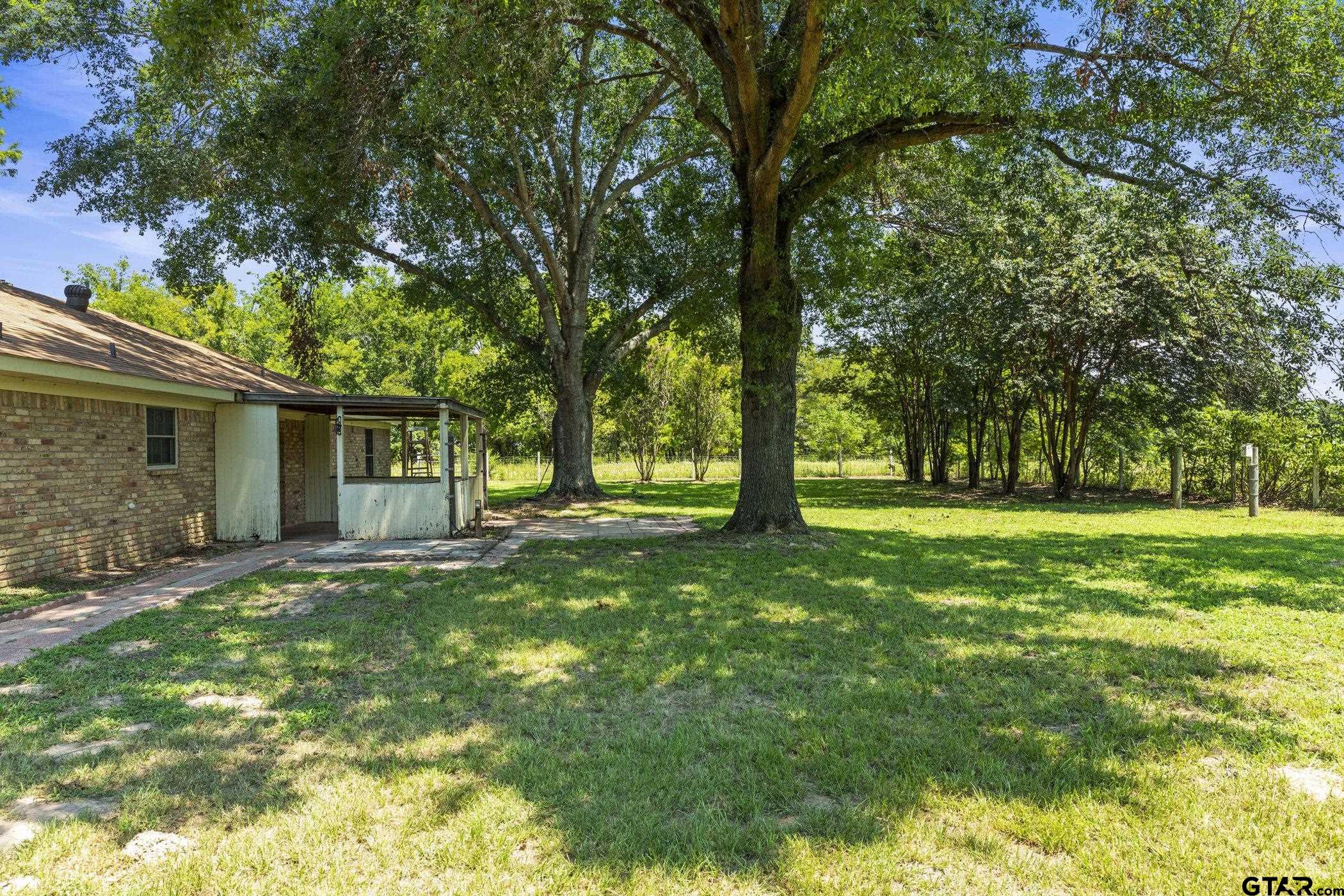 22741 County Road 448 Lindale, TX 75771 - Photo 7 of 48 a view of a house with a backyard