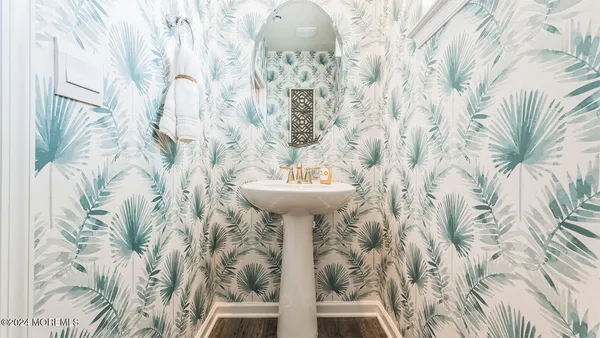 a bathroom with a sink and mirror