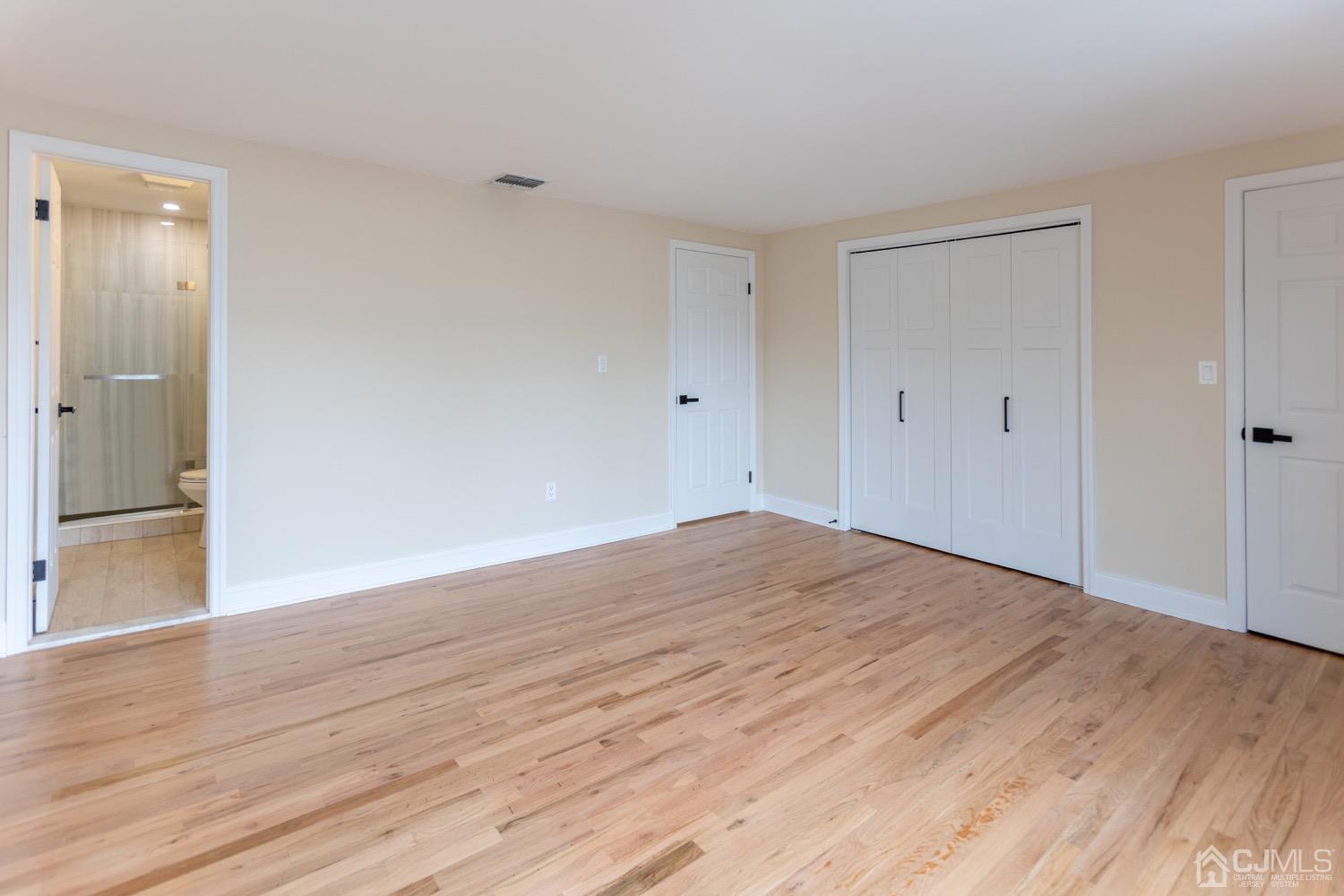 5004 Hana Road Edison, NJ 08817 - Photo 18 of 29 a view of empty room with wooden floor