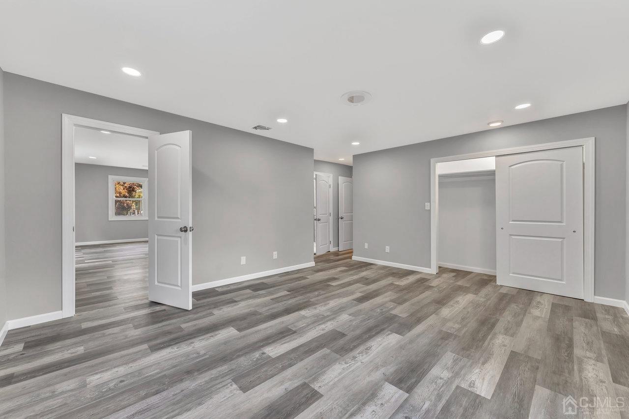 114 Morningside Road Colonia, NJ 07067 - Photo 14 of 27 a view of an empty room with wooden floor and closet
