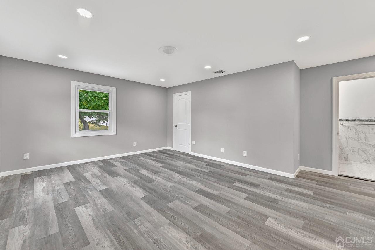 114 Morningside Road Colonia, NJ 07067 - Photo 15 of 27 a view of empty room with wooden floor