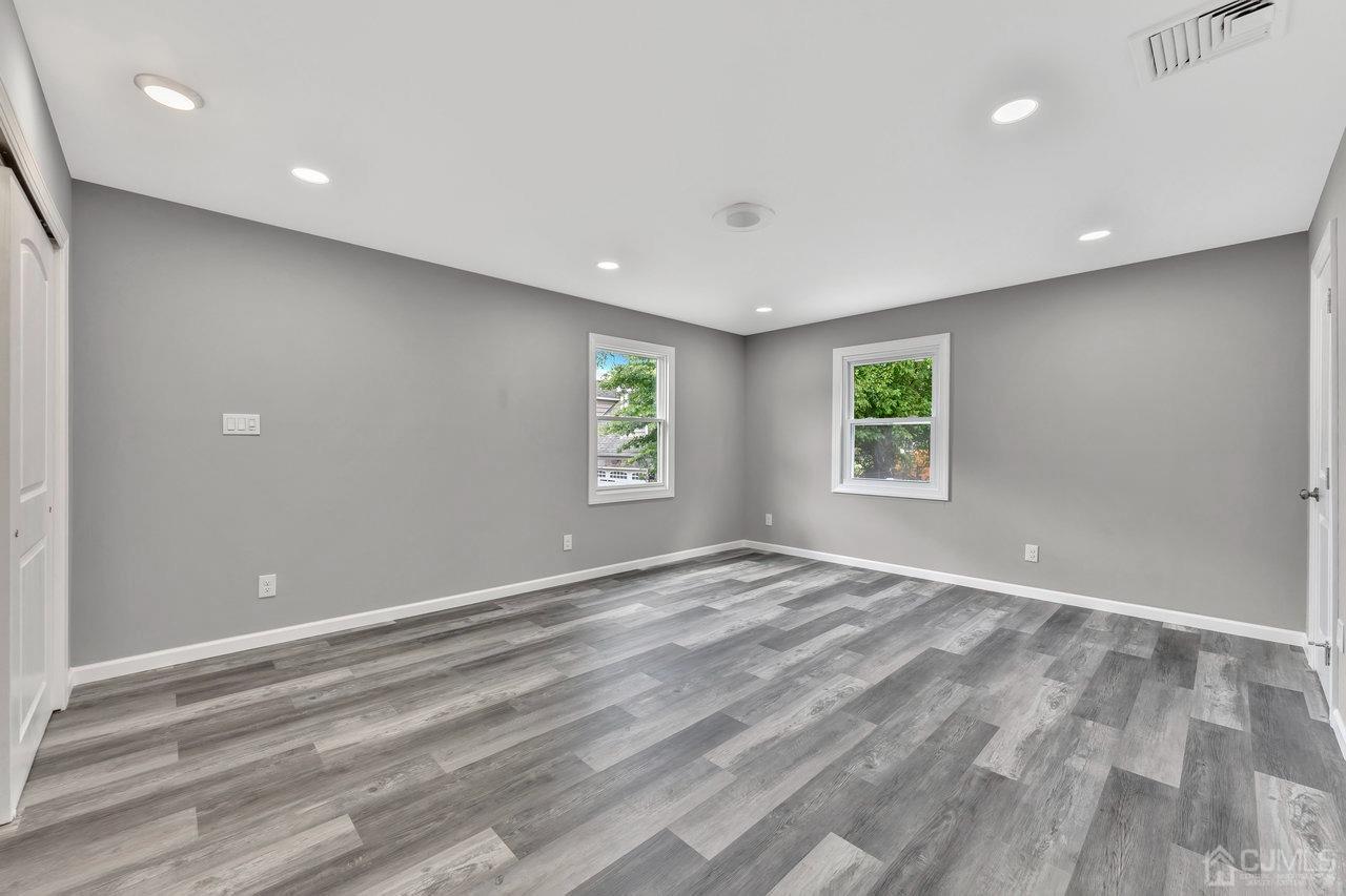 114 Morningside Road Colonia, NJ 07067 - Photo 16 of 27 an empty room with windows and closet