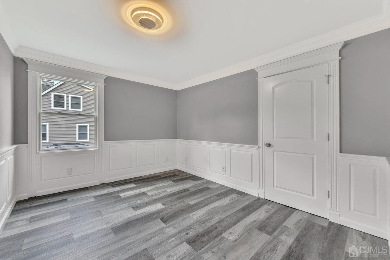 114 Morningside Road Colonia, NJ 07067 - Photo 19 of 27 wooden floor in an empty room