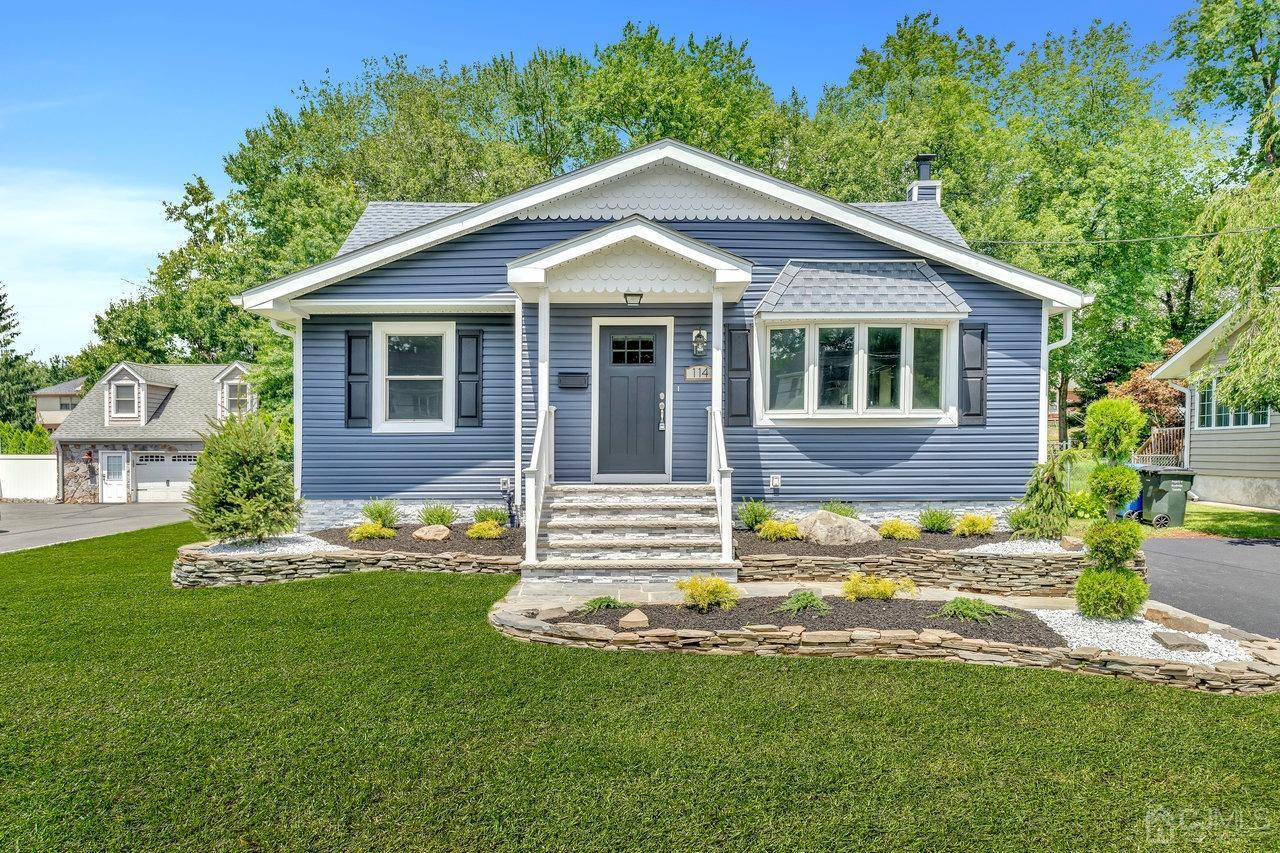 114 Morningside Road Colonia, NJ 07067 - Photo 2 of 27 a front view of a house with a yard