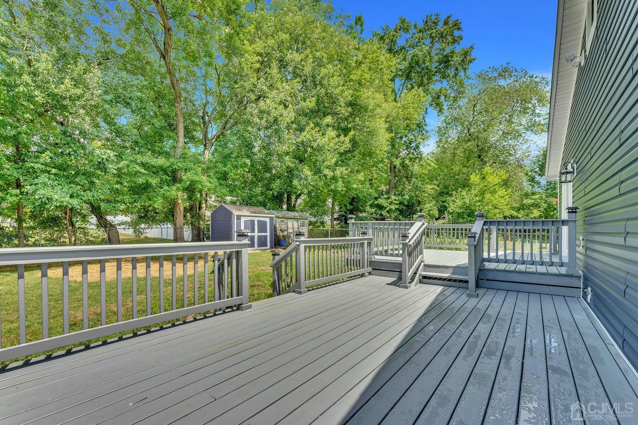 114 Morningside Road Colonia, NJ 07067 - Photo 24 of 27 a view of balcony with deck and wooden floor